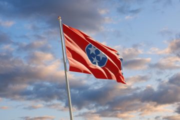 South Tennessee US State Flag at sky background. 3D artwork